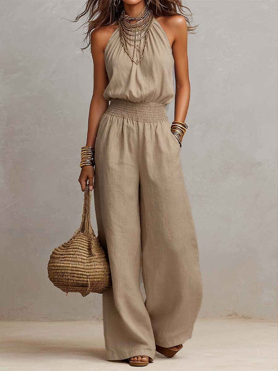 Mono mujer de espalda descubierta con escote halter y pierna ancha