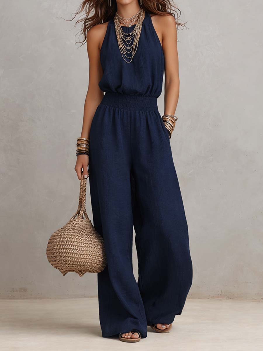 Mono mujer de espalda descubierta con escote halter y pierna ancha