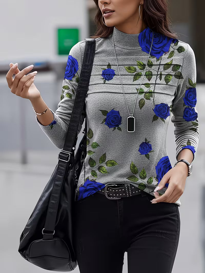 Blusa de mujer con estampado floral, cuello alto y mangas tres cuartos