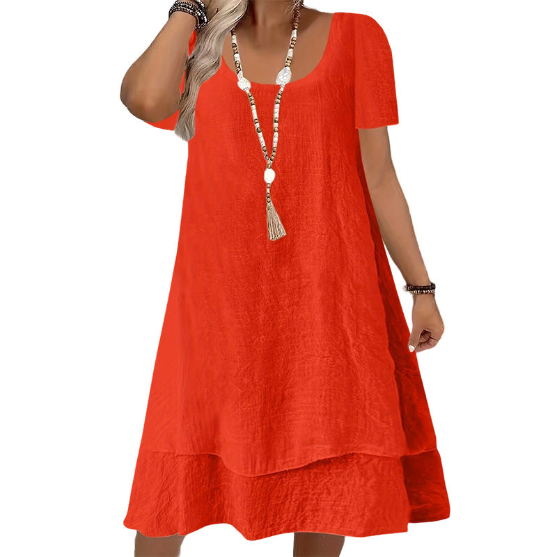 Vestido amplio de mujer con cuello redondo y mangas cortas