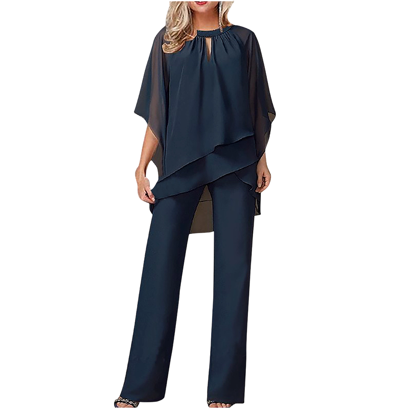Conjunto elegante mujer con blusa asimétrica y pantalón ancho