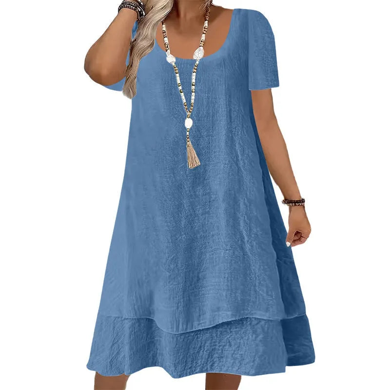 Vestido amplio de mujer con cuello redondo y mangas cortas