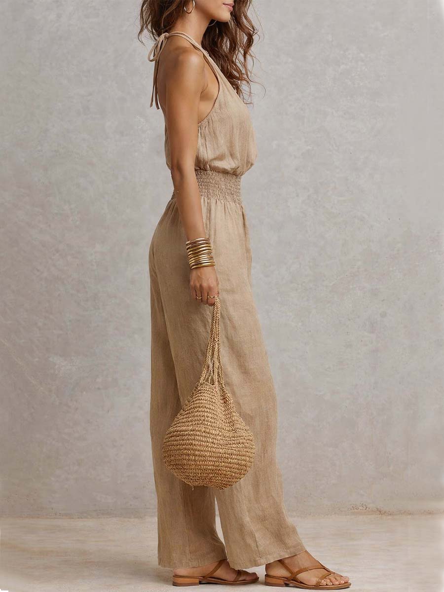 Mono mujer de espalda descubierta con escote halter y pierna ancha