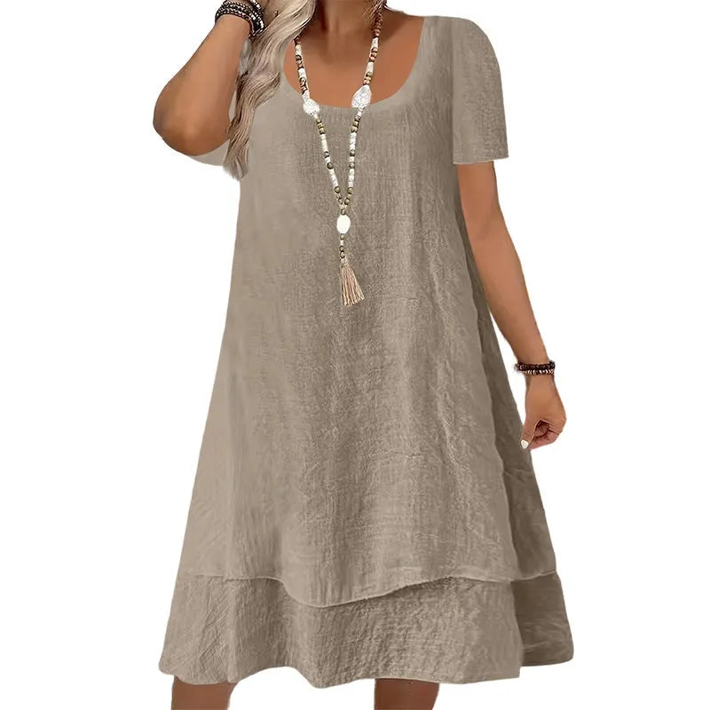 Vestido amplio de mujer con cuello redondo y mangas cortas