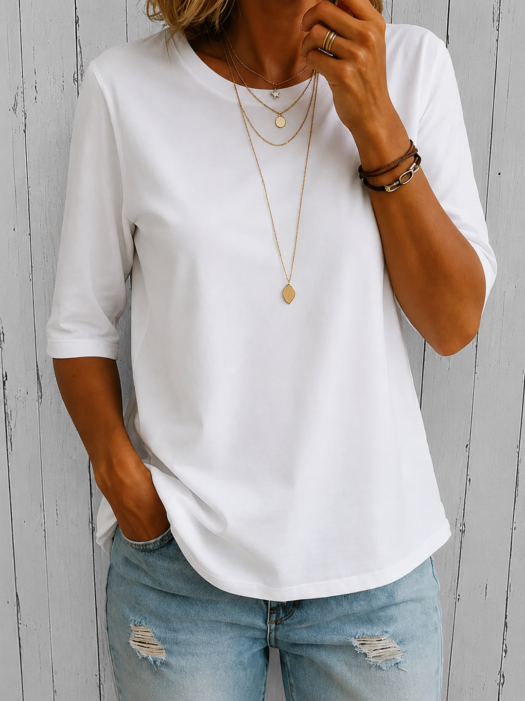 Camiseta casual de mujer con cuello redondo y mangas tres cuartos