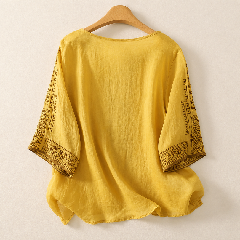 Blusa bordada de mujer con mangas tres cuartos y corte holgado