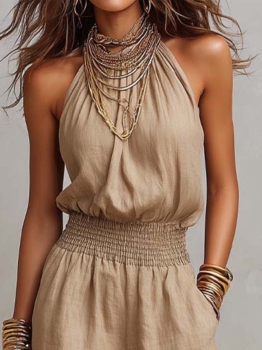 Mono mujer de espalda descubierta con escote halter y pierna ancha