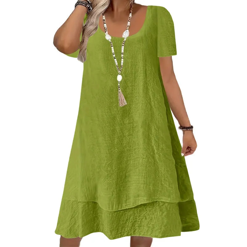 Vestido amplio de mujer con cuello redondo y mangas cortas
