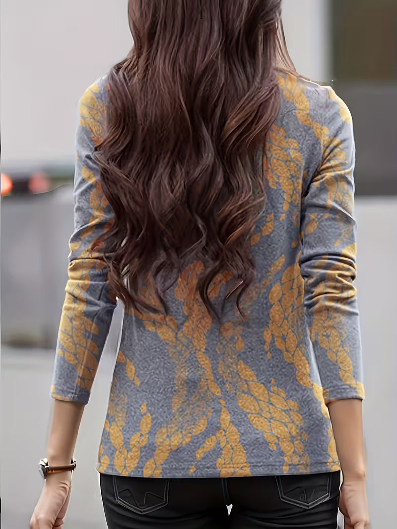 Blusa de mujer con estampado floral, cuello alto y mangas tres cuartos