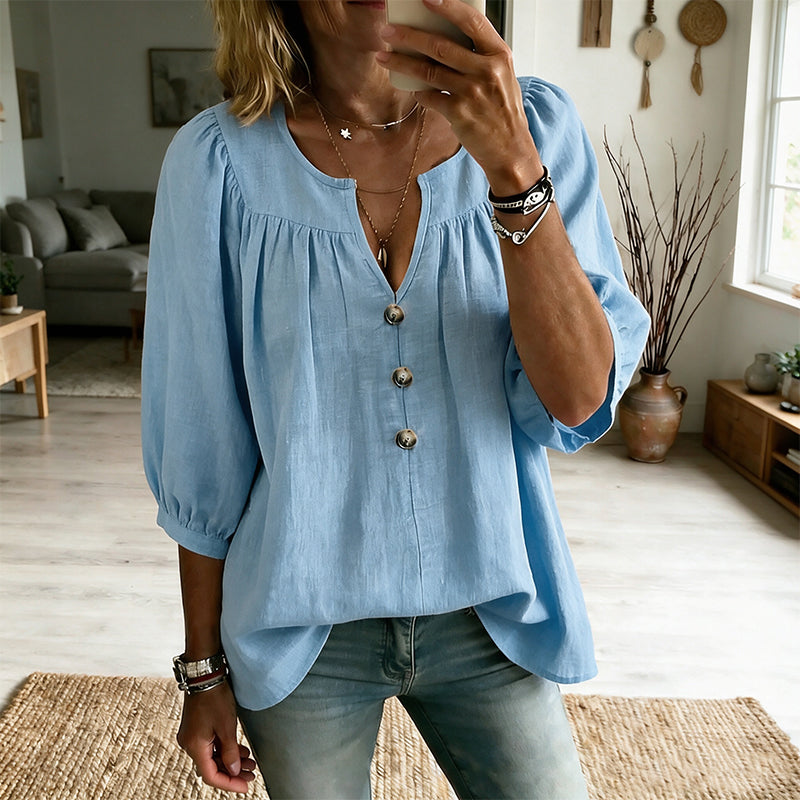 Blusa de mujer con escote en V, botones y mangas tres cuartos