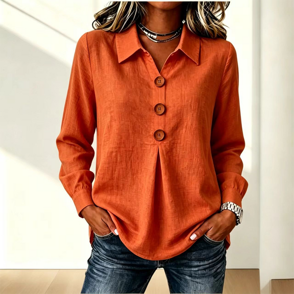 Blusa de mujer con cuello clásico y botones decorativos