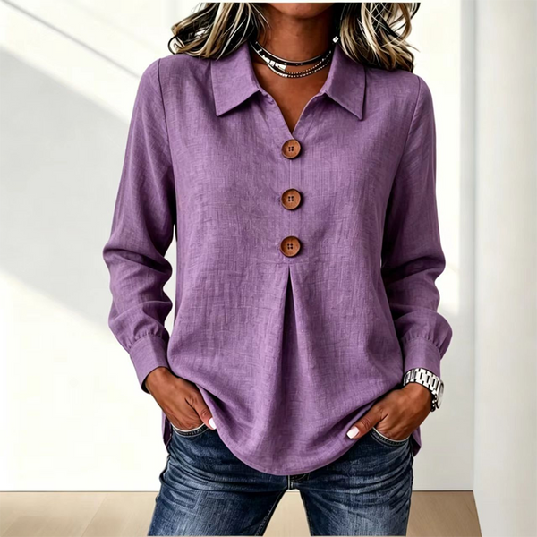 Blusa de mujer con cuello clásico y botones decorativos