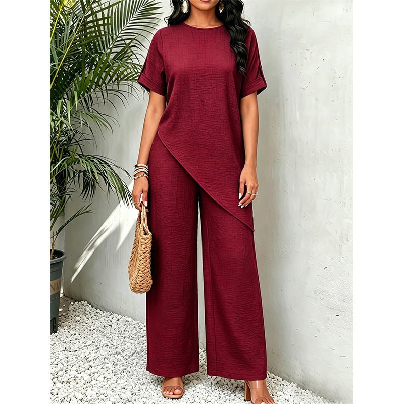 Conjunto de mujer con top asimétrico y pantalón de pernera ancha