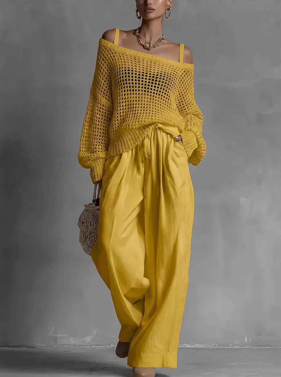 Conjunto de mujer con suéter calado y pantalón ancho